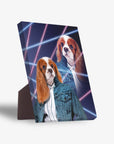 Two Cavalier King Charles Spaniels in 80s-style denim jackets on a dark canvas with neon grid lines.