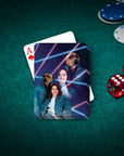 Personalized playing cards with 1980s lazer portrait of a woman and two dogs on a green felt table.
