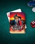 Personalized 'Boney and Clyde' playing cards featuring two dogs in suits, on a green felt table with chips and dice.