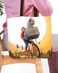 Personalized "Doggo-Terrestrial" pet and human portrait tote bag with a dog in a basket on a bicycle.