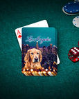 Personalized playing cards featuring a golden retriever portrait over a Los Angeles cityscape, on a green felt table with poker chips and dice.