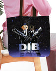 Personalized 'Dogs in Black' pet portrait tote bag featuring two dogs in suits with guns against a starry background.