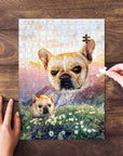 Personalized pet puzzle featuring two French Bulldogs in a mountain valley landscape, with hands assembling pieces.