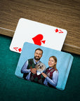 Personalized playing cards featuring a custom portrait of a man, woman, and white dog.