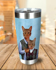 Personalized stainless steel tumbler with two custom cat portraits in argyle sweaters on a light blue background.