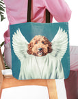 Personalized tote bag with a custom pet portrait of a dog as an angel on a blue background.