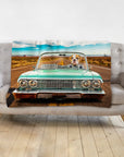 Personalized pet blanket with a bulldog driving a teal lowrider car on a desert road.