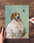 Personalized pet puzzle featuring a dog in a renaissance-style pearl gown, with hands assembling it.