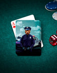 Personalized playing card featuring a dog's head on a police officer's uniform, on a green felt table.