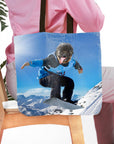 Personalized tote bag with a custom pet portrait of a pug snowboarding on a snowy mountain.