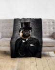 Personalized pet blanket with a pug in a black top hat and suit, draped over a grey sofa.