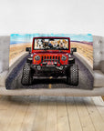 Personalized 4-pet blanket with dogs in a red Jeep on a desert road.