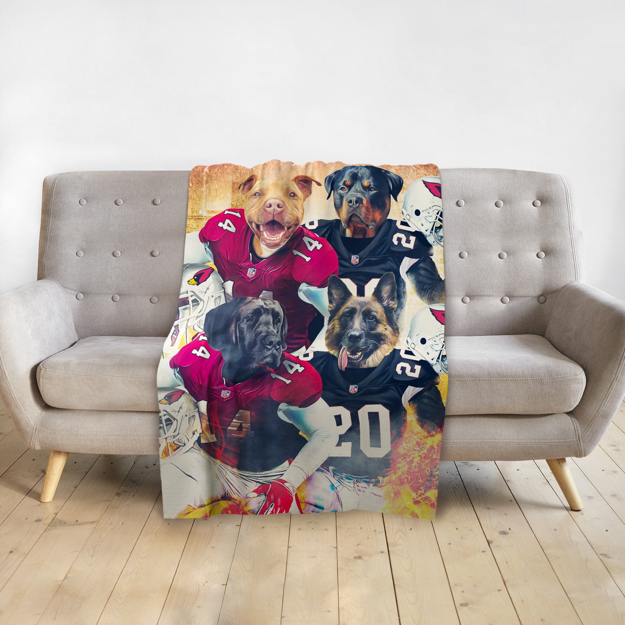 Personalized blanket with four dogs in football uniforms, draped over a grey sofa.