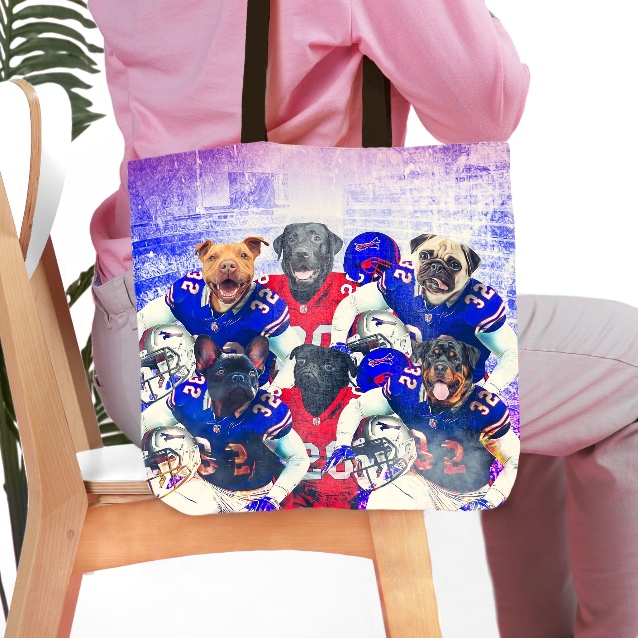 Personalized 'Buffalo Doggos' 6-pet tote bag with dogs in football uniforms, held by a person.