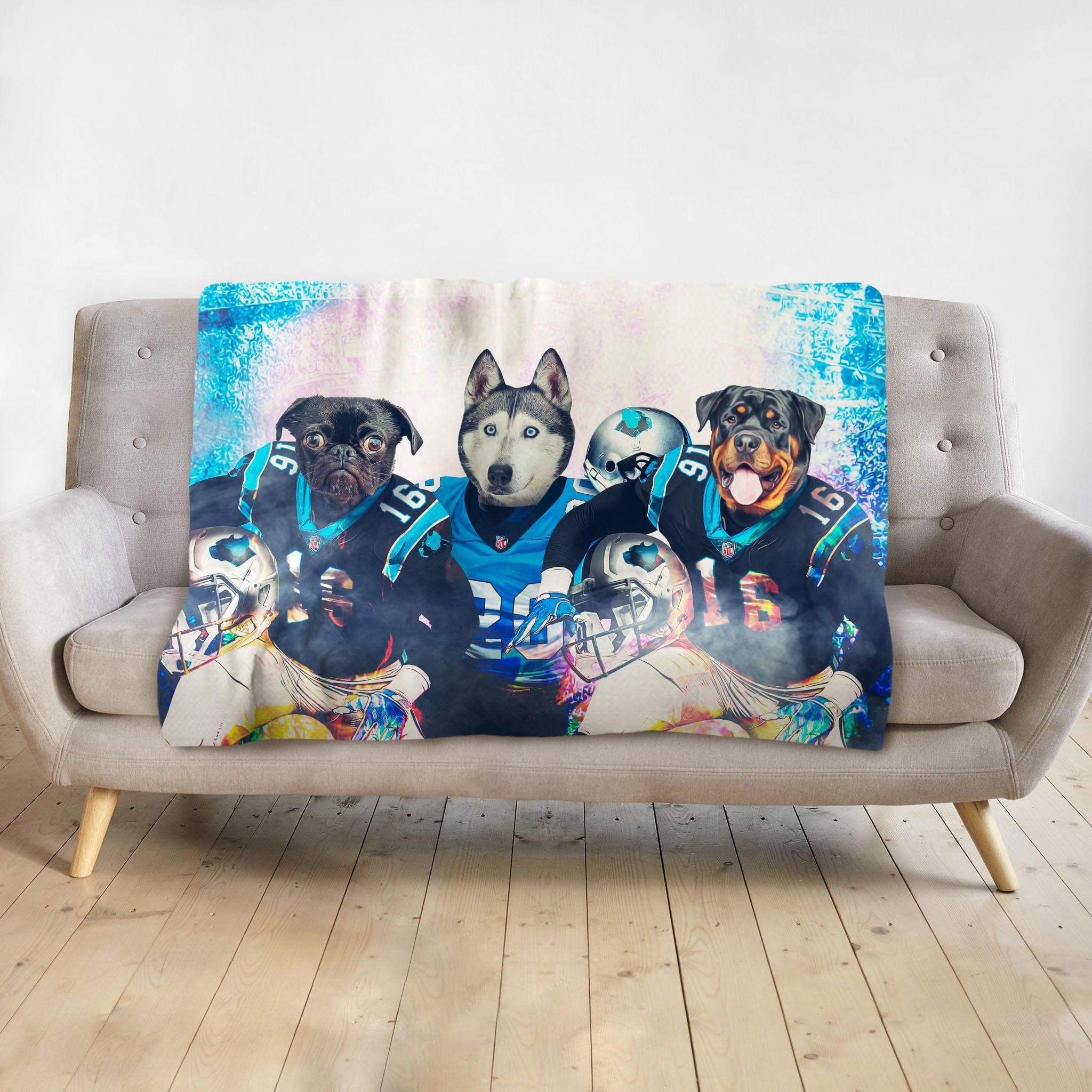 Personalized pet blanket with three dogs in Carolina Panthers football uniforms.