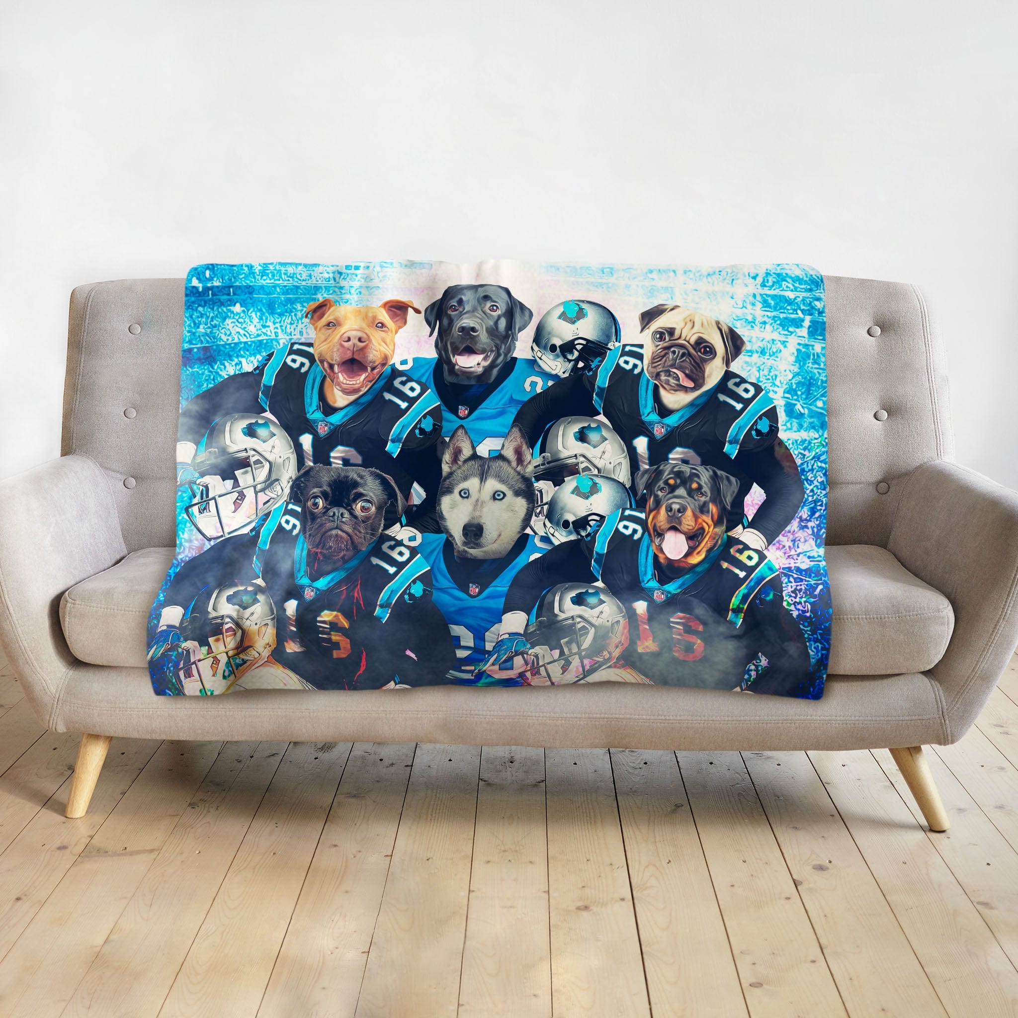 Personalized pet blanket with six dogs in Carolina football uniforms on a gray sofa.
