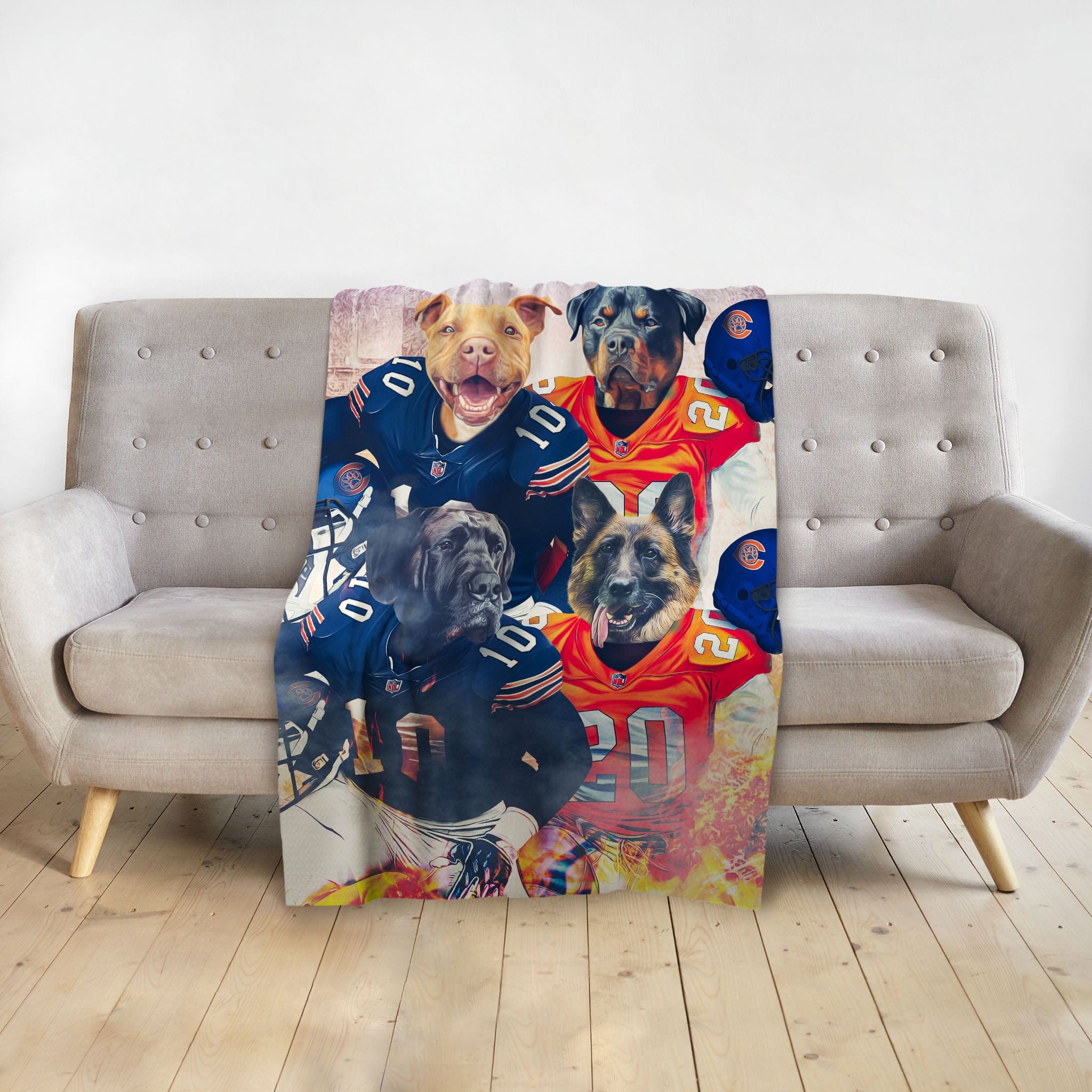 Personalized minky blanket with four dogs in custom football uniforms on a gray sofa.