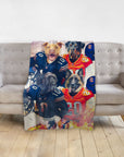 Personalized minky blanket with four dogs in custom football uniforms on a gray sofa.