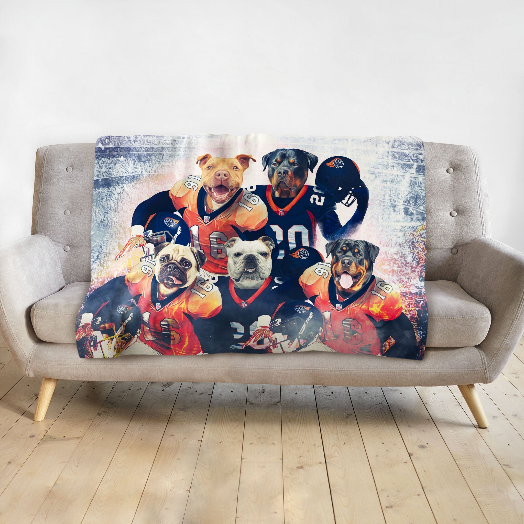 Personalized 5-pet blanket with dogs in football jerseys, draped on a gray sofa.