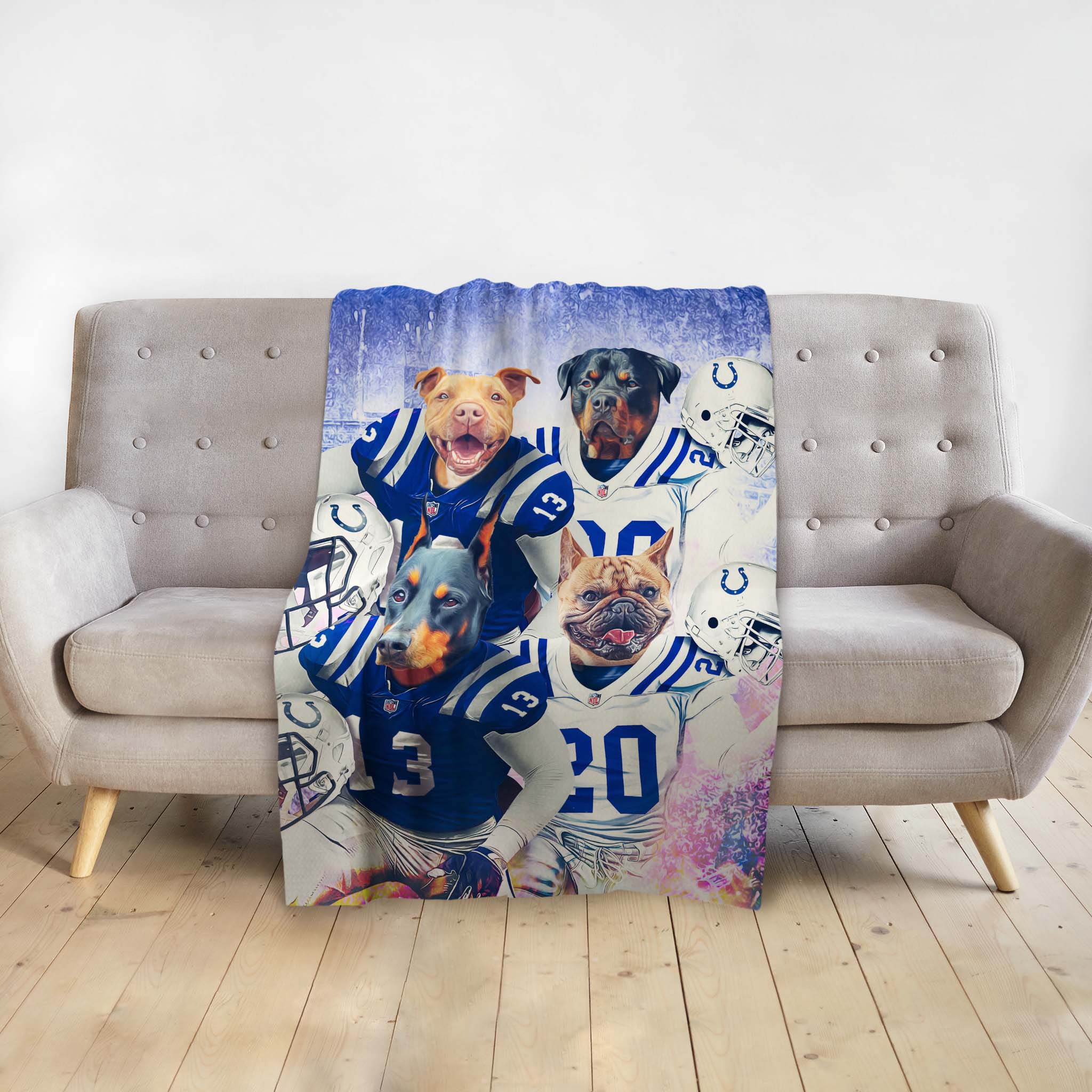 Personalized 4-pet blanket with dogs in blue and white football uniforms.