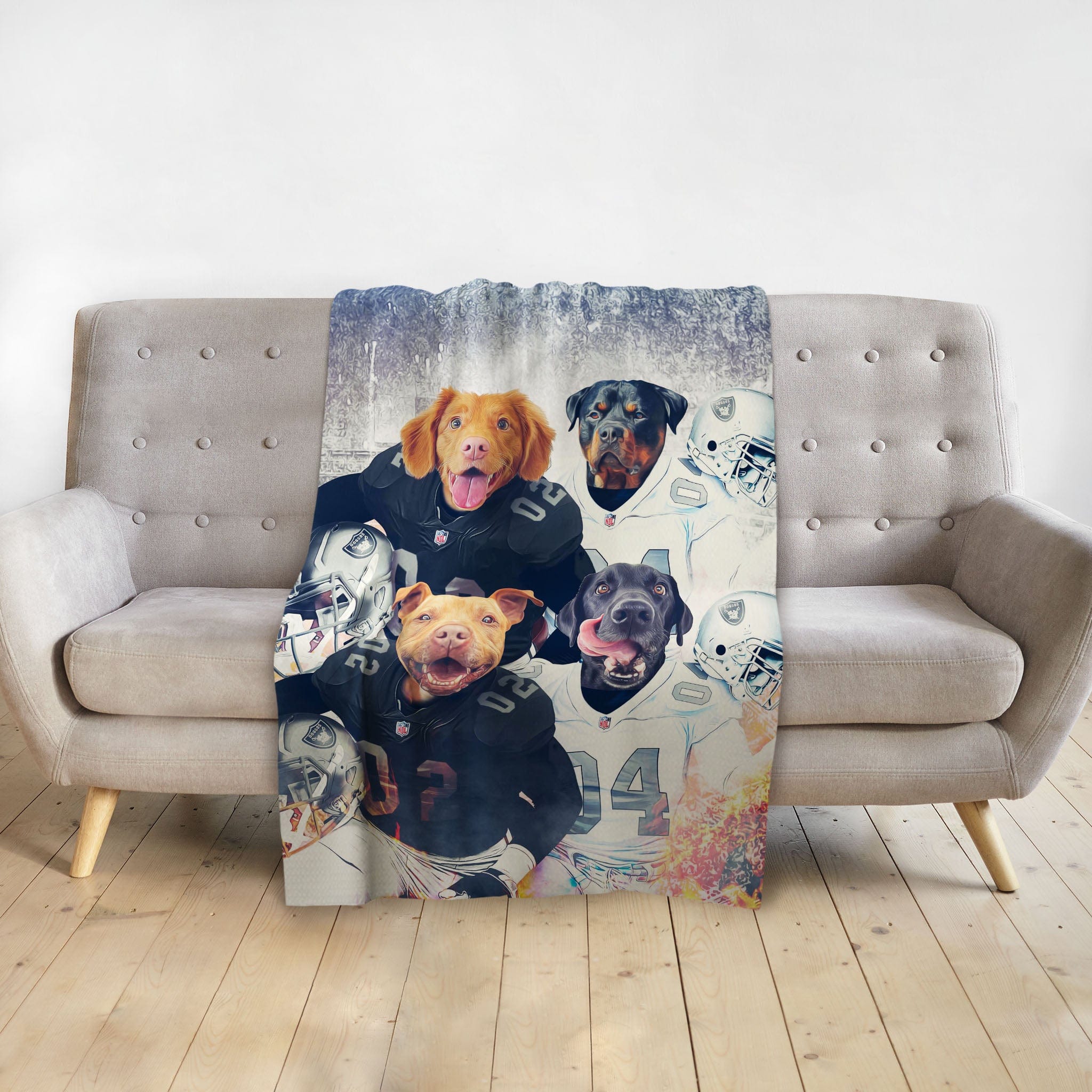 Personalized pet blanket with four dogs in football uniforms on a grey sofa.