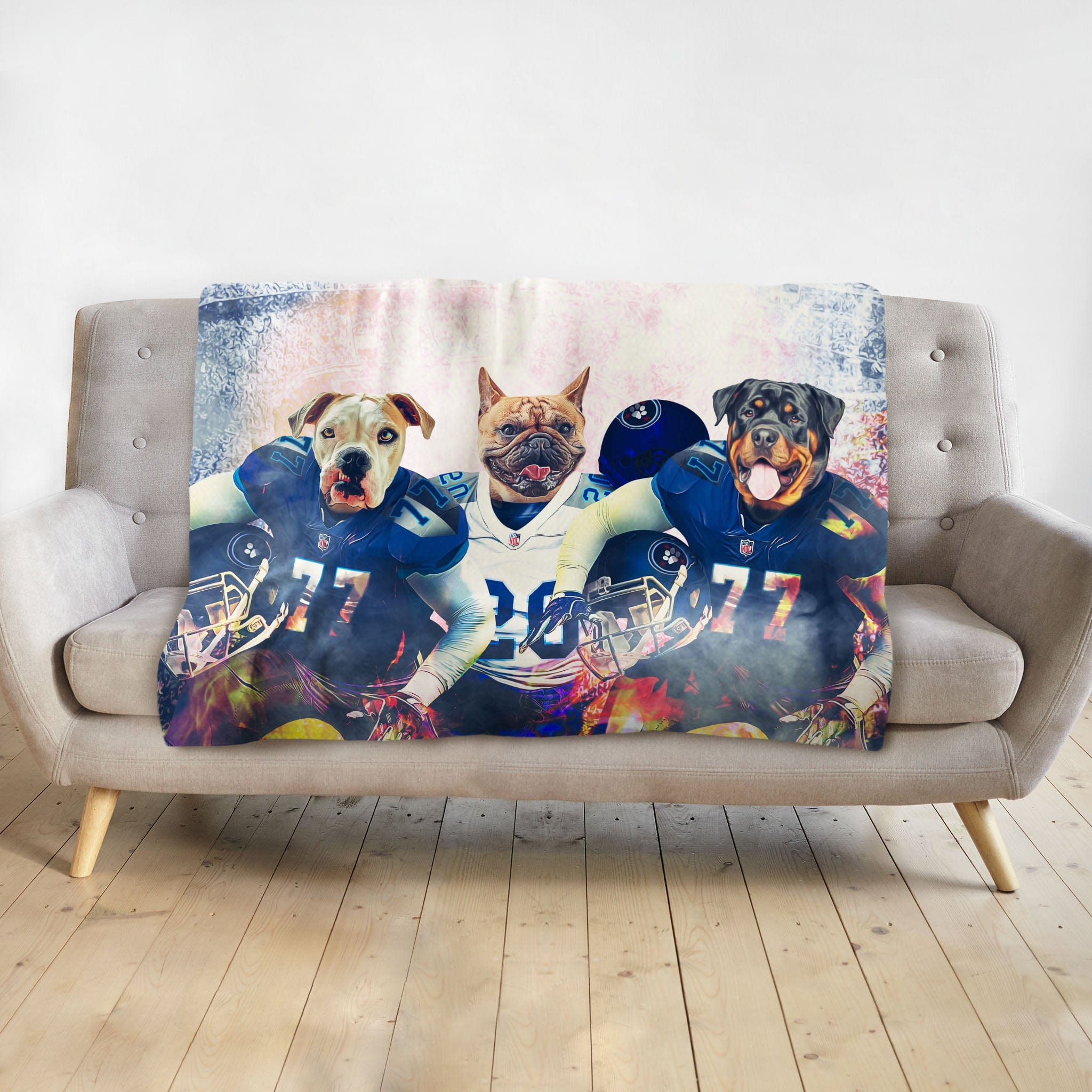 Personalized 3-pet blanket with dogs in blue and white football uniforms.