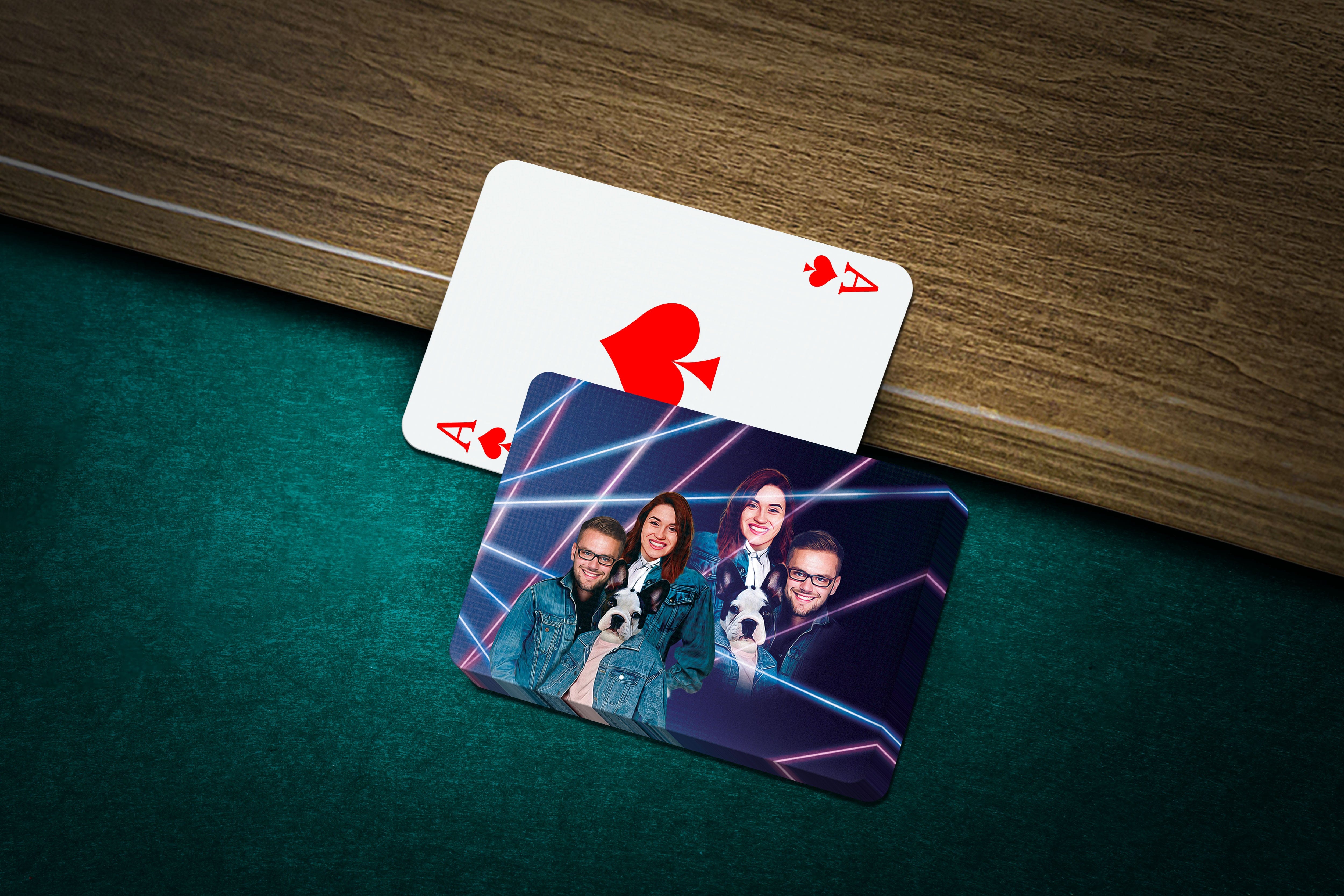 Personalized playing cards with a custom 1980s Lazer Portrait of humans and a dog on a green felt table.