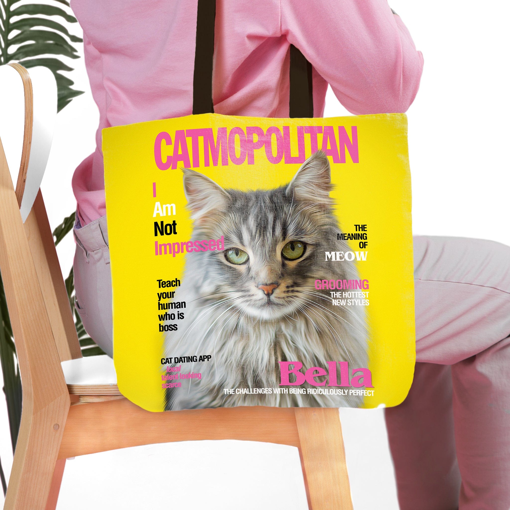 Personalized yellow "Catmopolitan" tote bag featuring a custom cat portrait with green eyes.