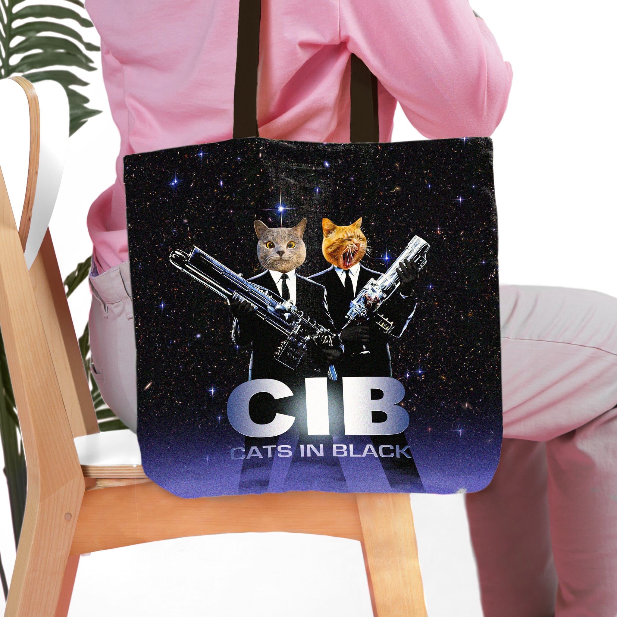 Personalized black tote bag with two custom cat portraits dressed as "Cats in Black" agents.