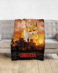 Personalized 'Catzilla' pet blanket with a giant cat portrait over a city skyline at sunset.