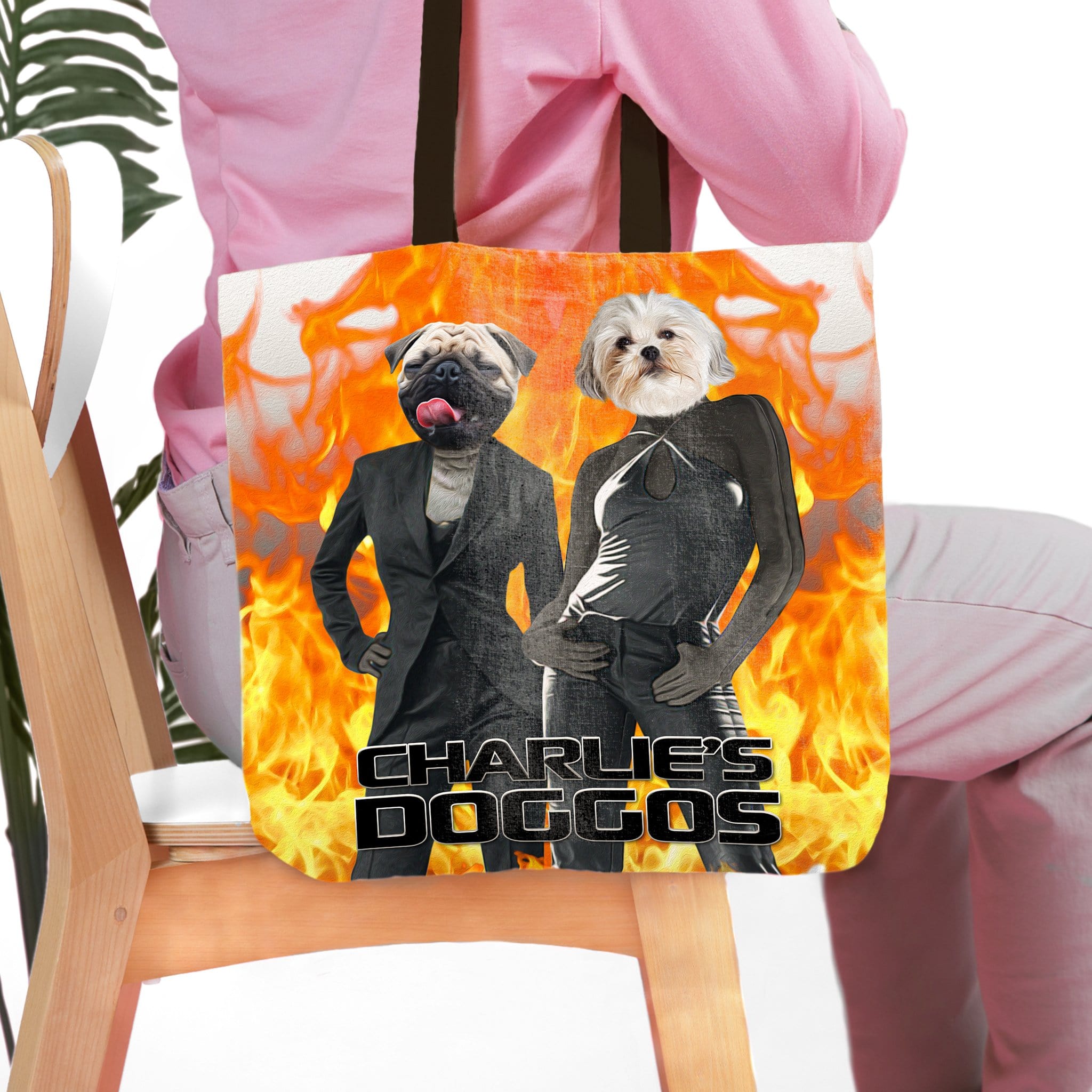 Personalized 2 pet tote bag with dog portraits in suits, "Charlie's Doggos" text, and fiery background.