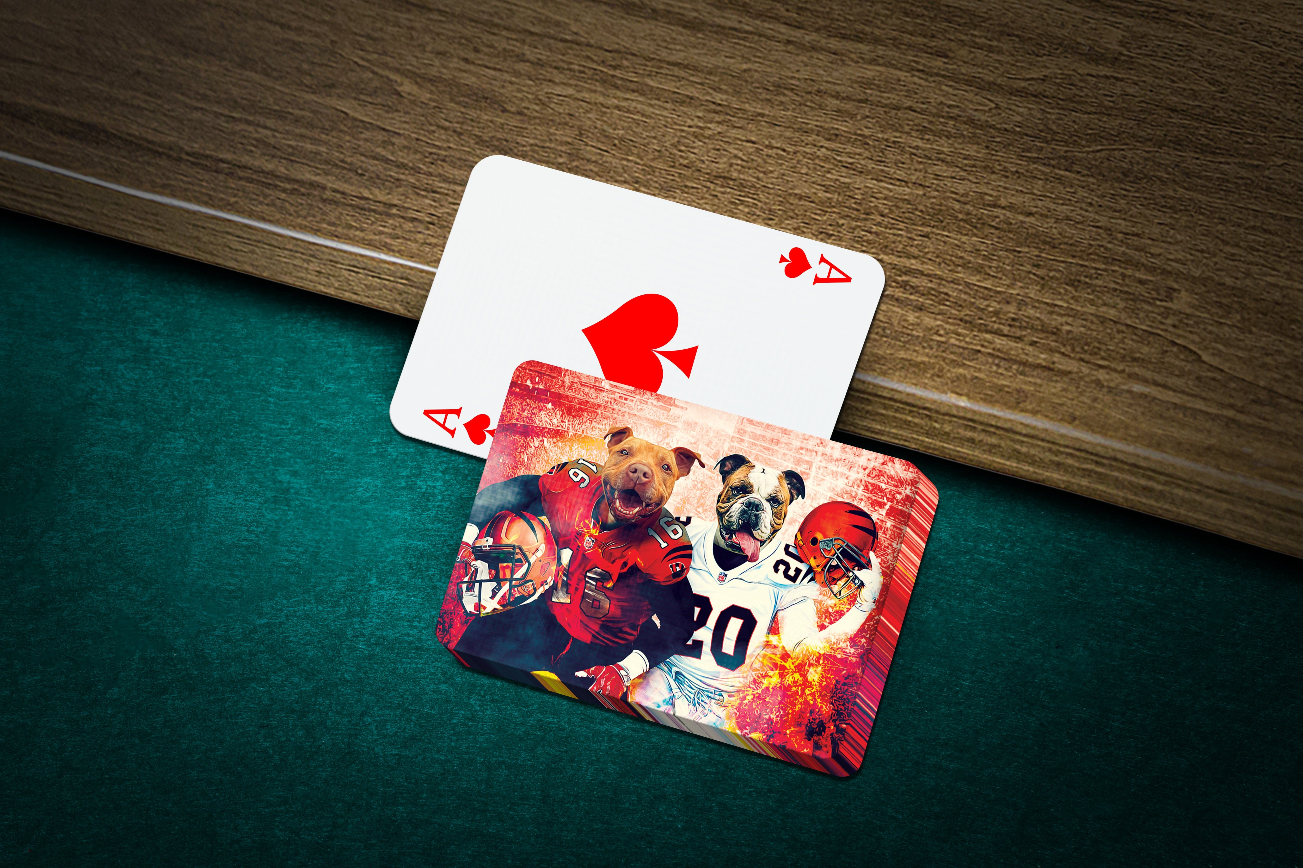 Personalized playing cards featuring two dogs in football uniforms, one Ace of Spades card visible.