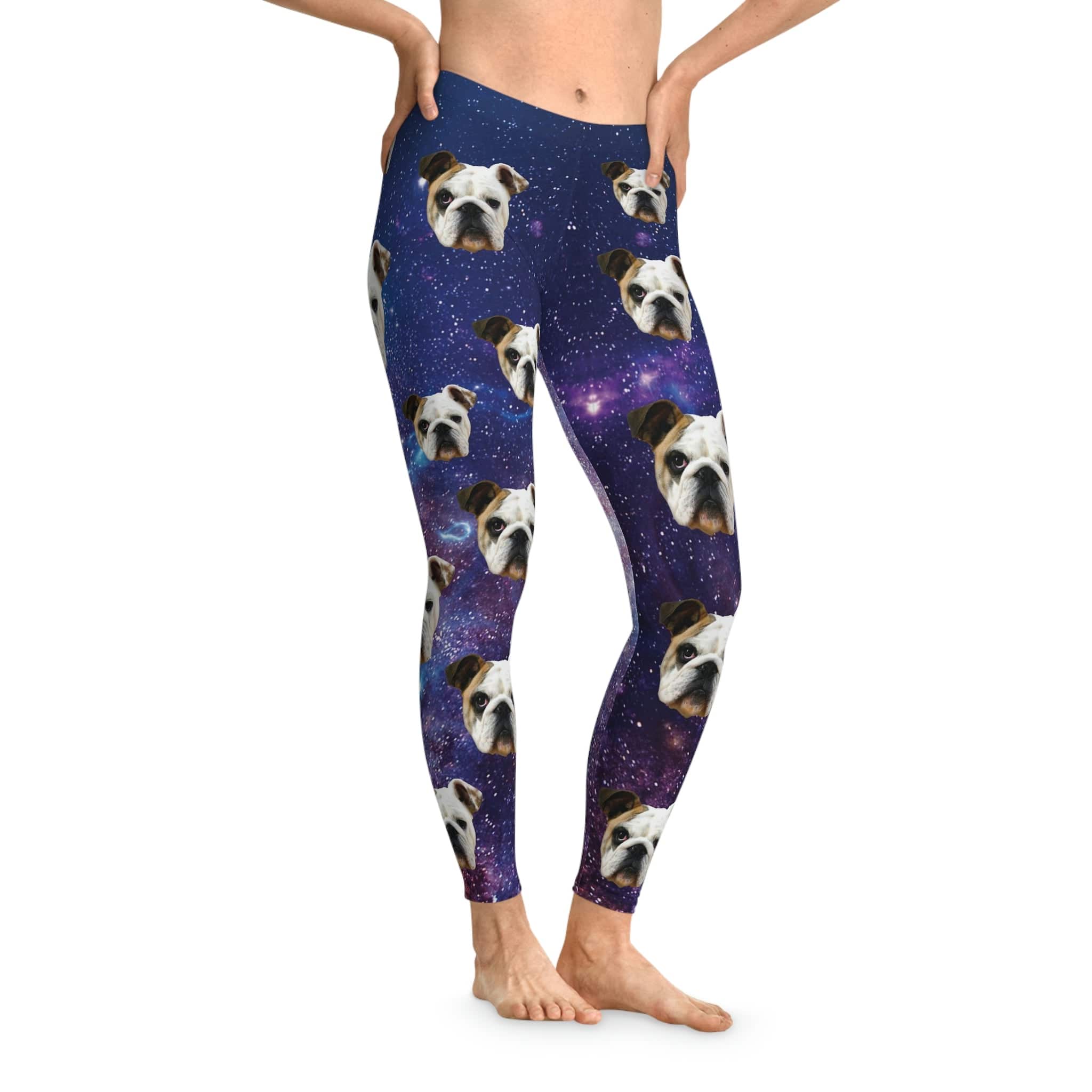 Custom leggings featuring bulldog faces on a vibrant purple "Doggos in Space" galaxy background.