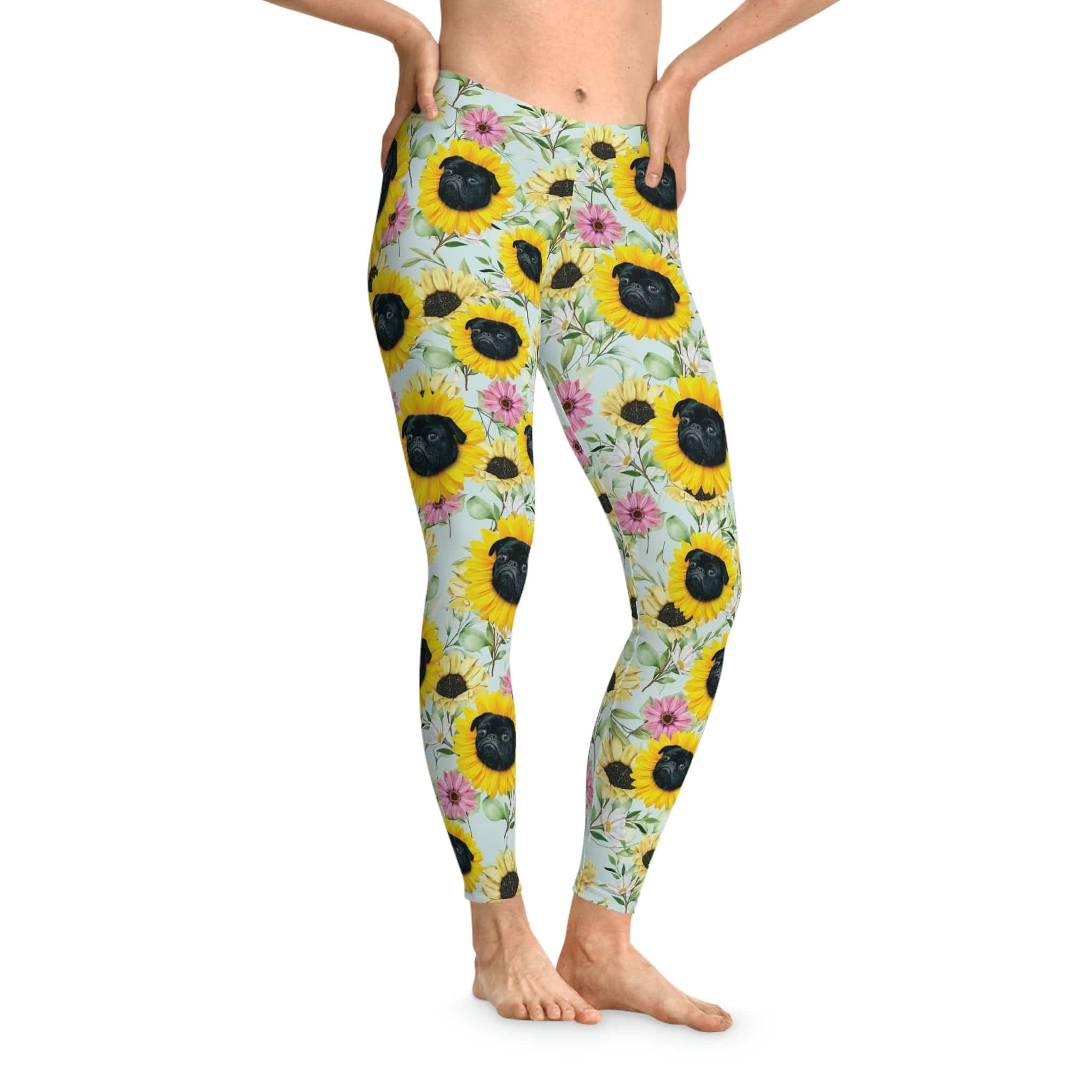 Custom leggings with a "Sunflower Sky" design featuring black pugs in sunflowers and pink flowers.