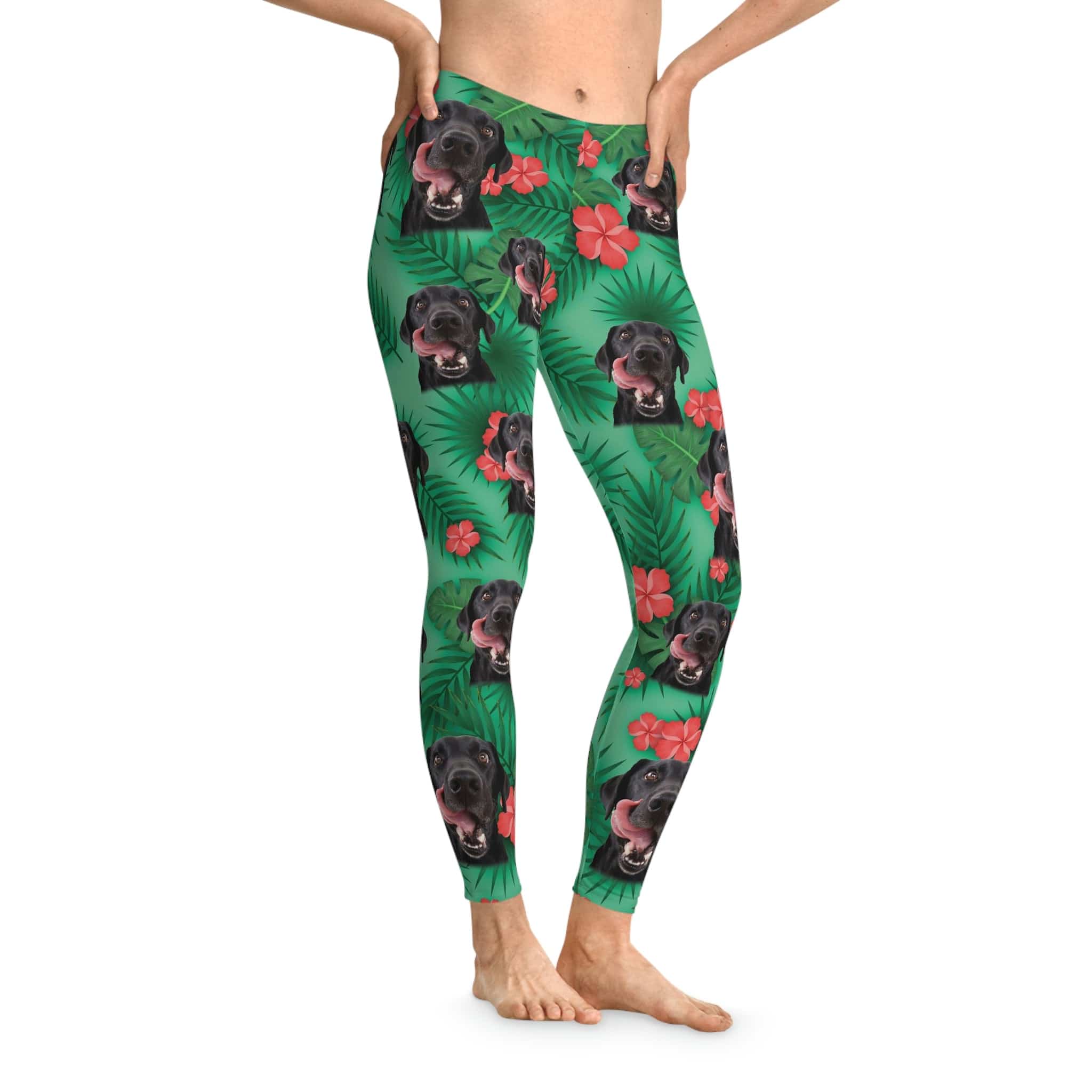 Trident green custom leggings with a repeating pattern of black dogs, tropical leaves, and red hibiscus flowers.