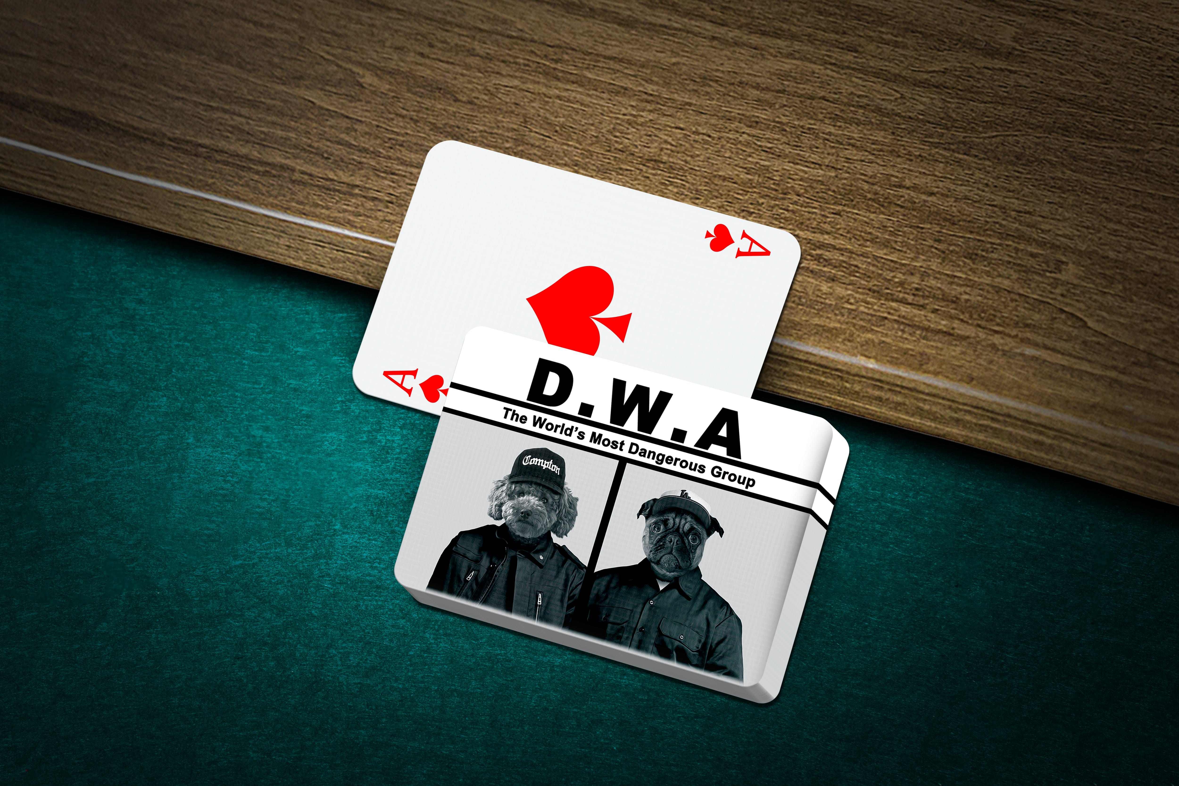 Personalized D.W.A. playing cards featuring two custom pet portraits on a green felt table.