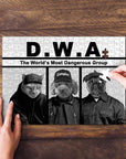 Personalized D.W.A. pet puzzle featuring a cat, poodle, and pug in black and white, with a hand placing a piece.