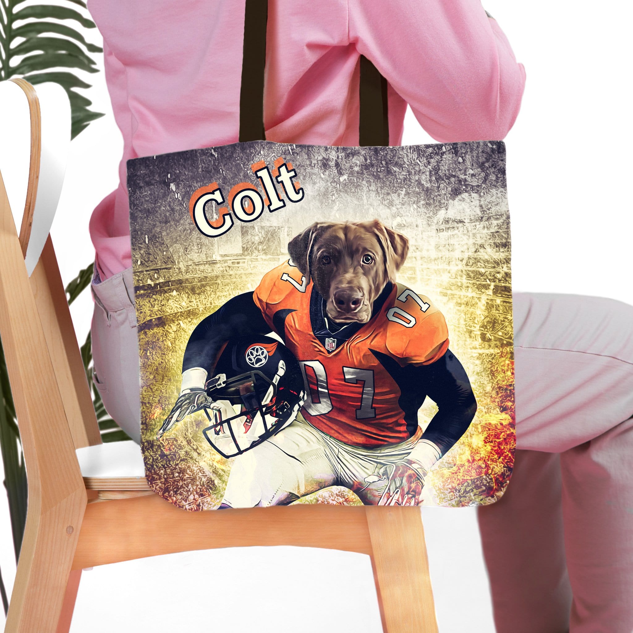 Personalized tote bag with a custom cartoon portrait of a chocolate lab dog in a football uniform.