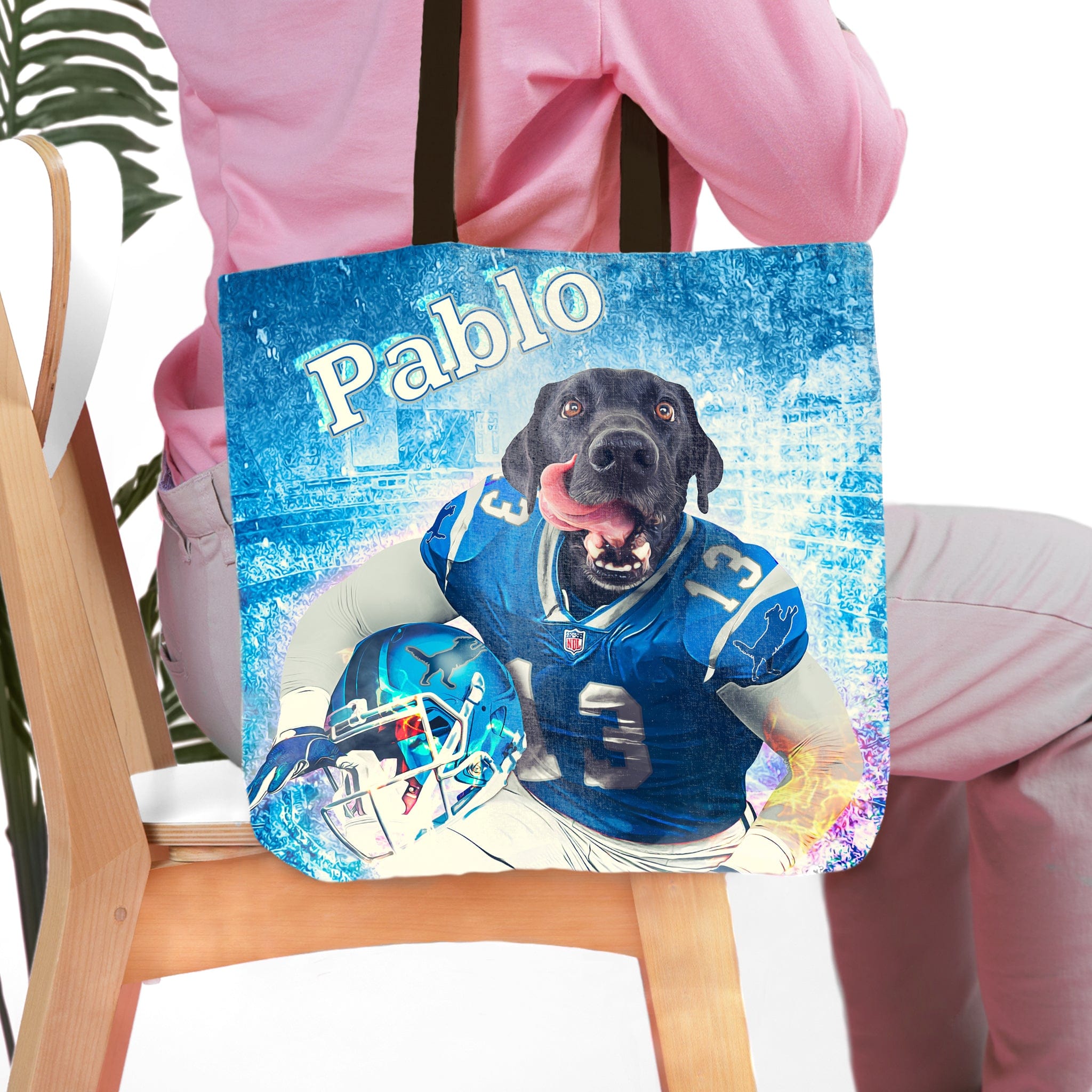 Personalized Detroit Doggos tote bag with a custom black dog portrait in a blue football uniform.