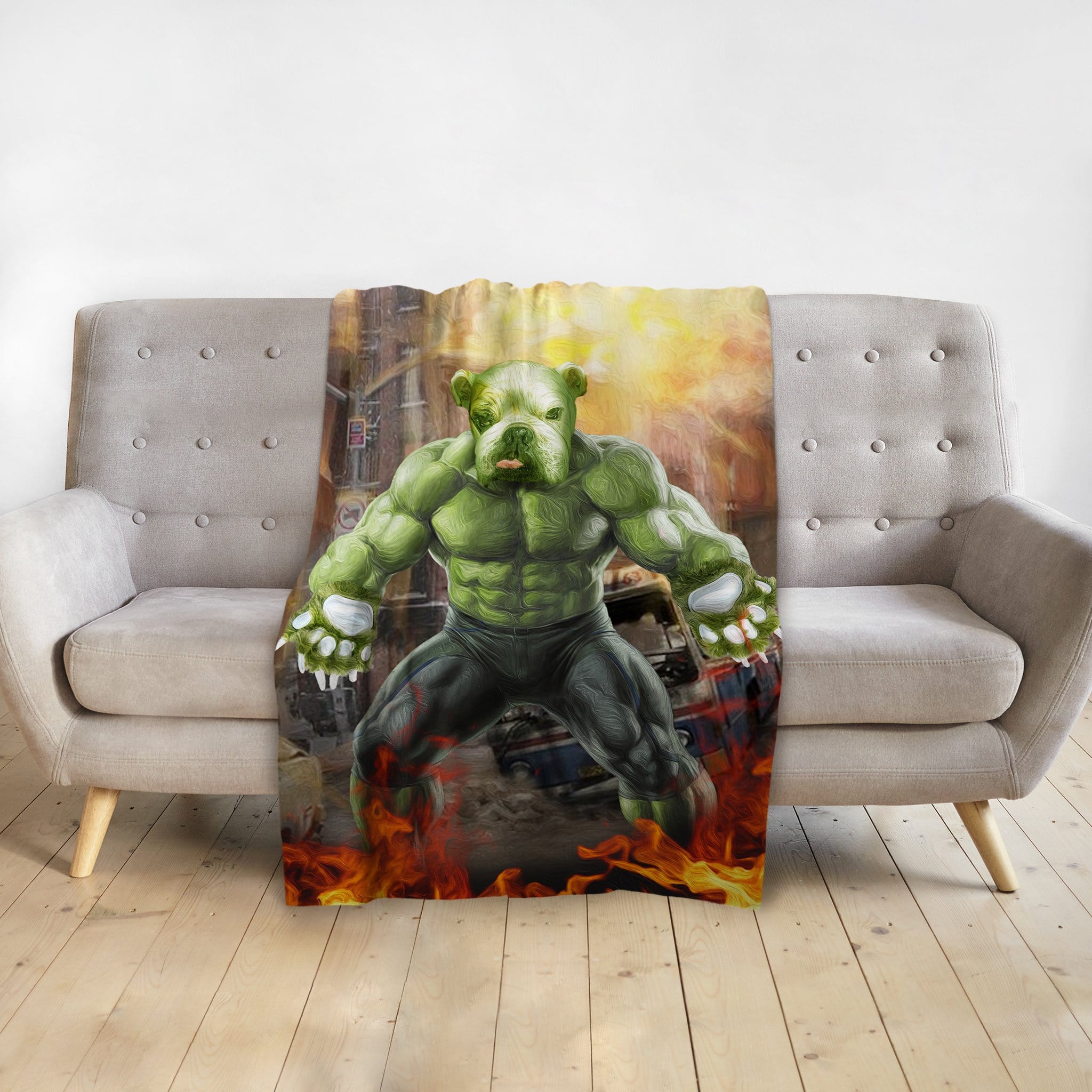 Personalized pet blanket with a green Doggo Hulk portrait on a gray sofa.