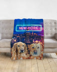 Personalized blanket with two golden retriever dog portraits and a New York City skyline at night.