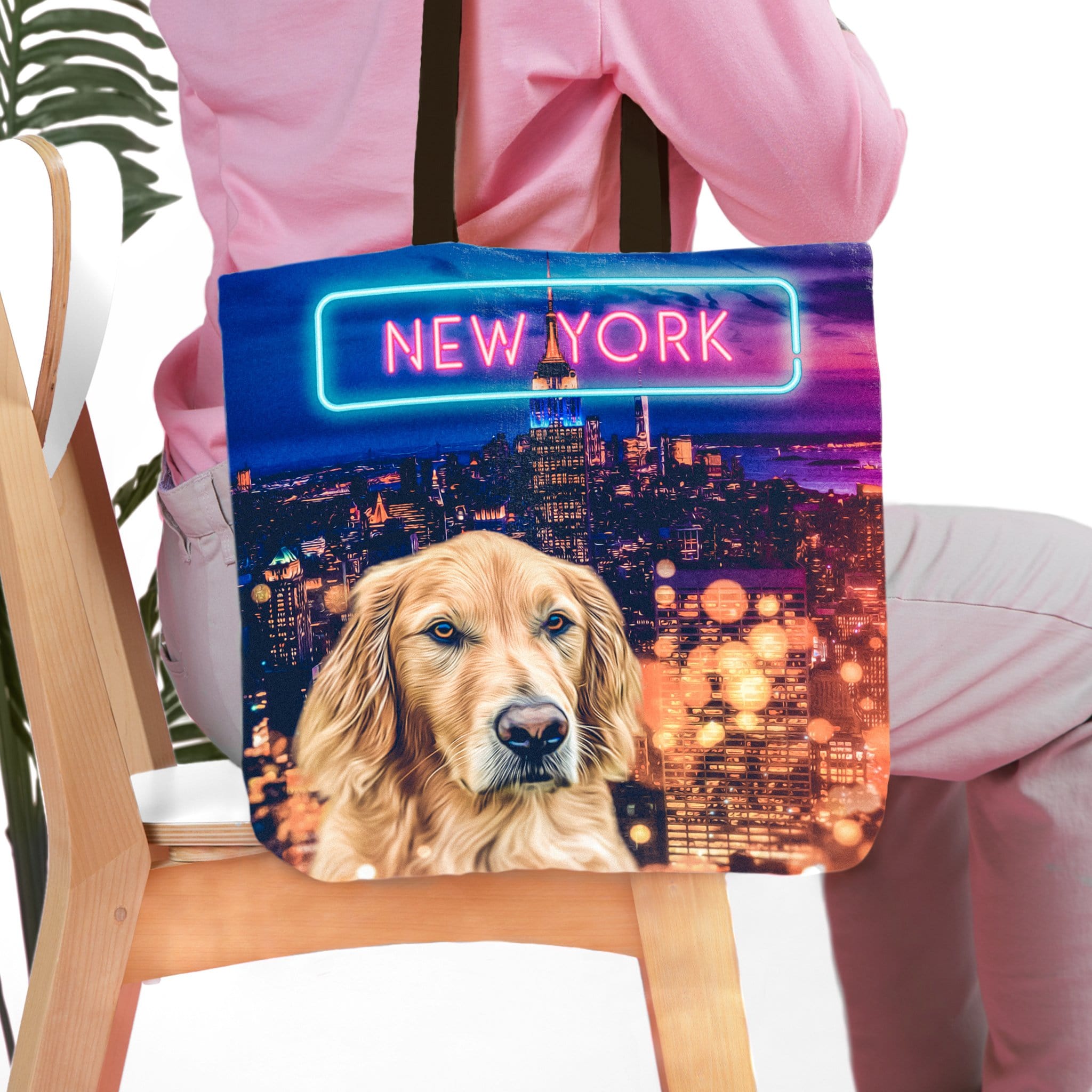 Personalized tote bag with a golden retriever pet portrait and a New York city skyline background.
