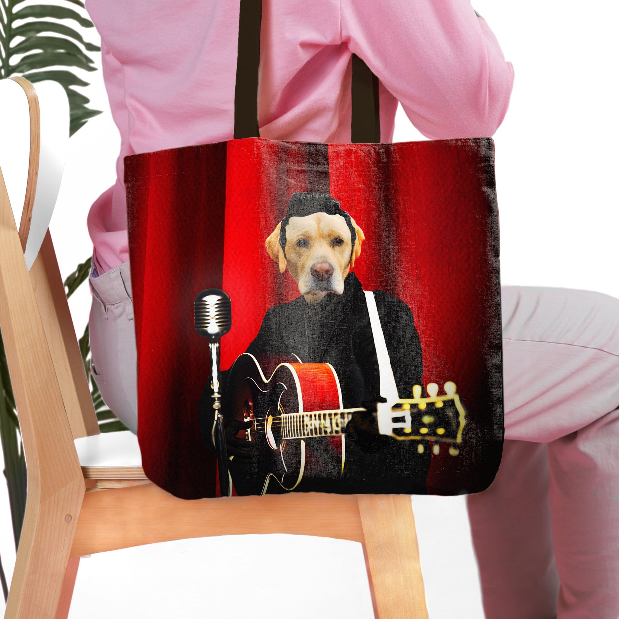 Personalized tote bag with a custom dog portrait in a rock and roll style, playing guitar against a red curtain.