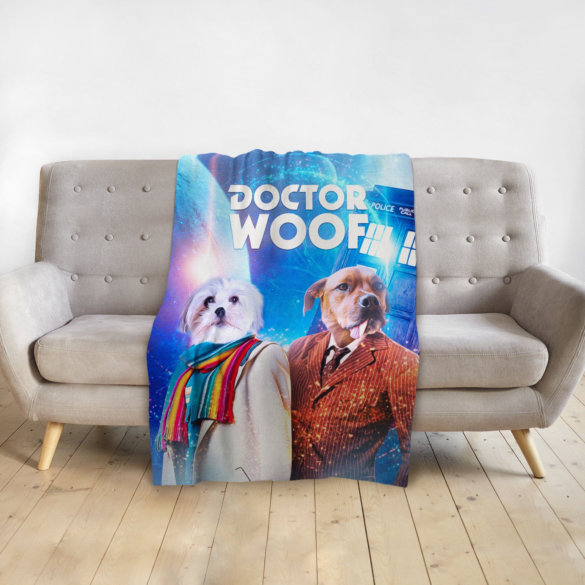 Personalized "Dr. Woof" pet blanket with two dogs in Doctor Who-style costumes on a gray couch.