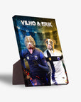 Personalized standing canvas featuring two dogs in soccer uniforms, "VILHO & ERIK" at the top.