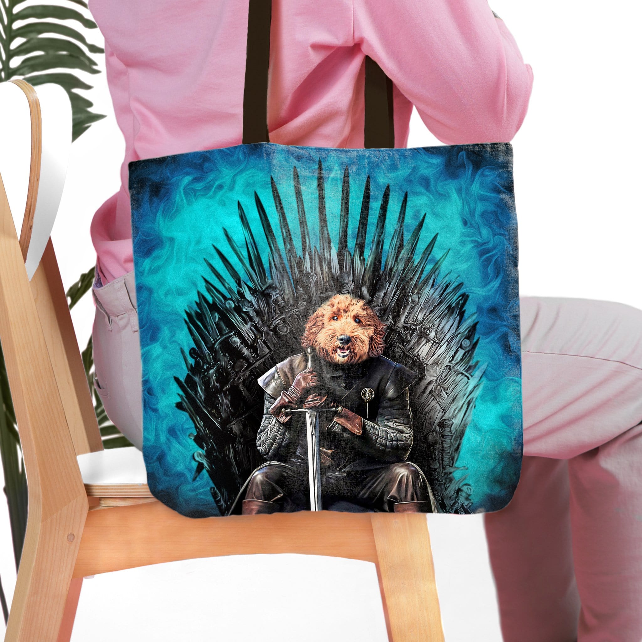 Personalized Game of Bones tote bag with a custom pet portrait of a dog on an iron throne.