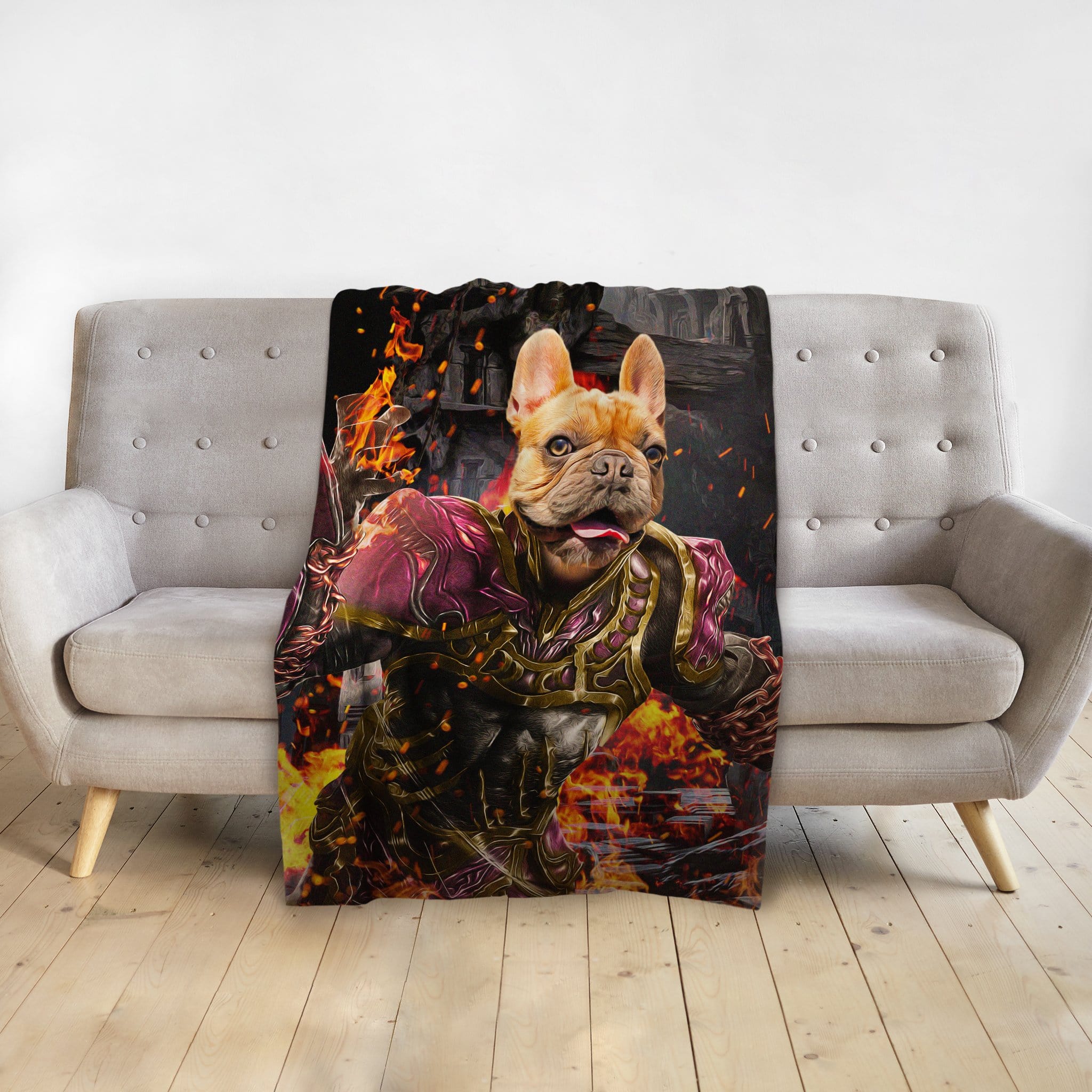 Personalized pet blanket with a French Bulldog in Hades-style armor, surrounded by fire, draped on a gray sofa.