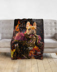 Personalized pet blanket with a French Bulldog in Hades-style armor, surrounded by fire, draped on a gray sofa.