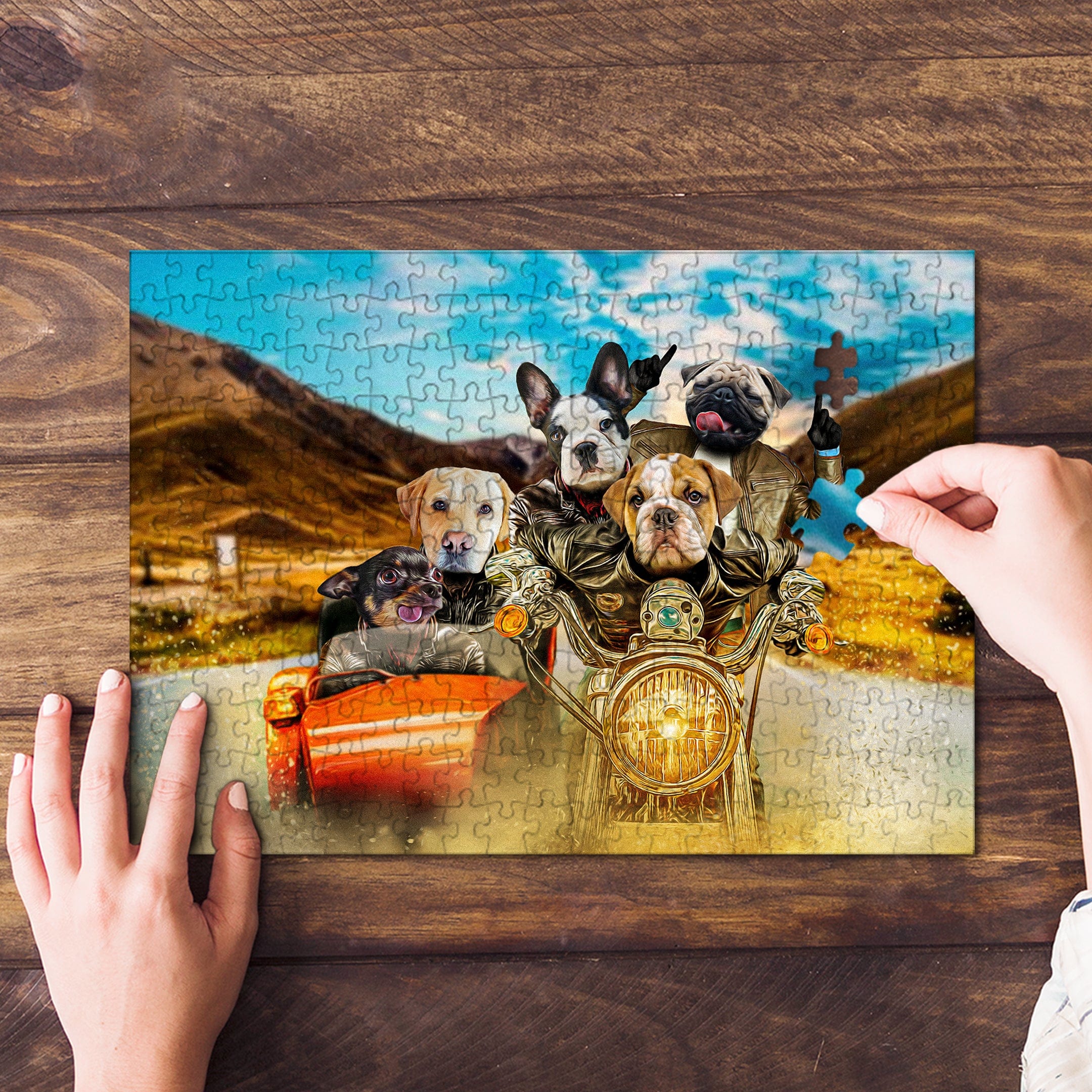 Personalized 5-pet puzzle featuring dogs on a motorcycle and in a car, with a hand adding a piece.