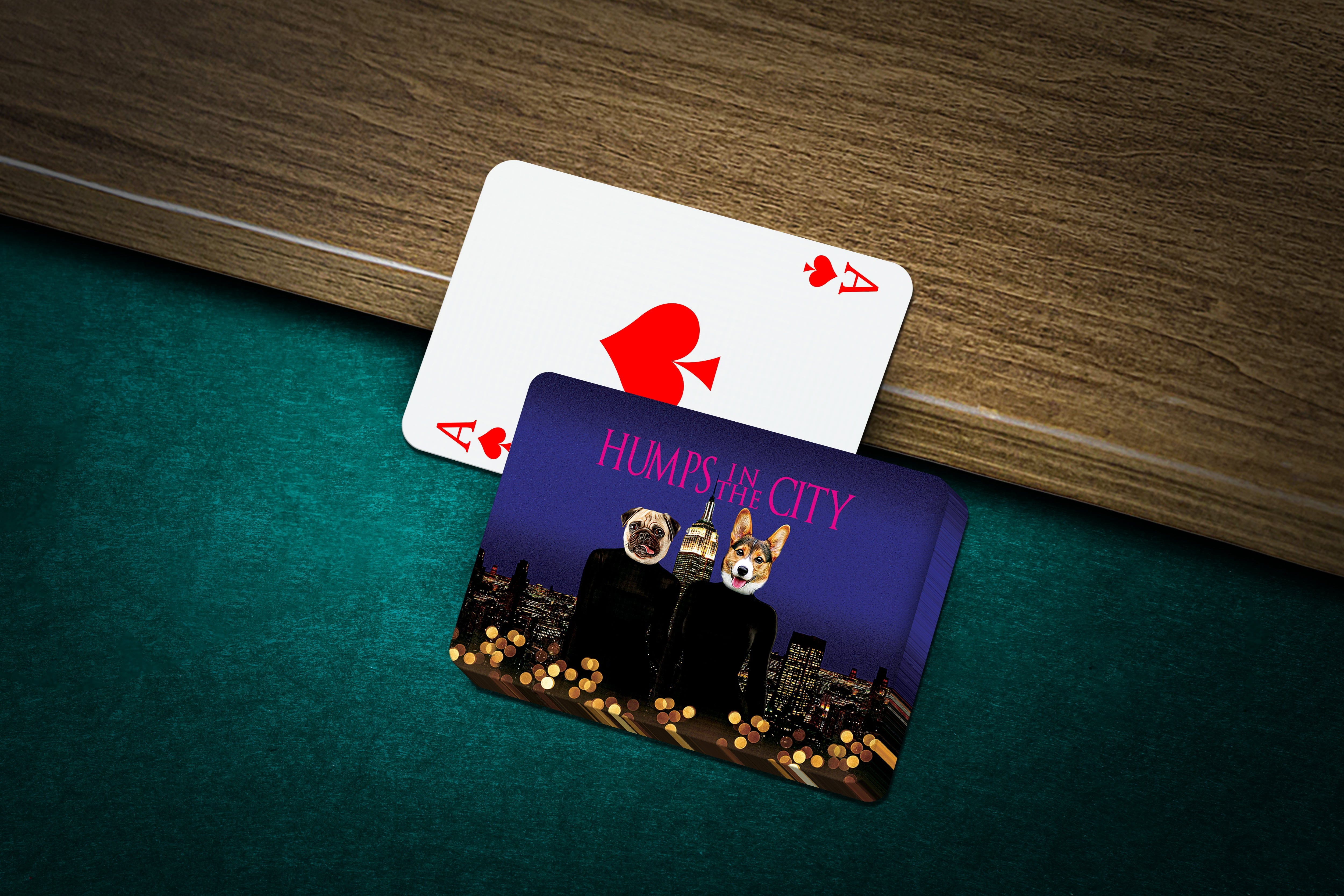 Personalized playing cards featuring two pets with human bodies over a city skyline, next to an Ace of Spades.